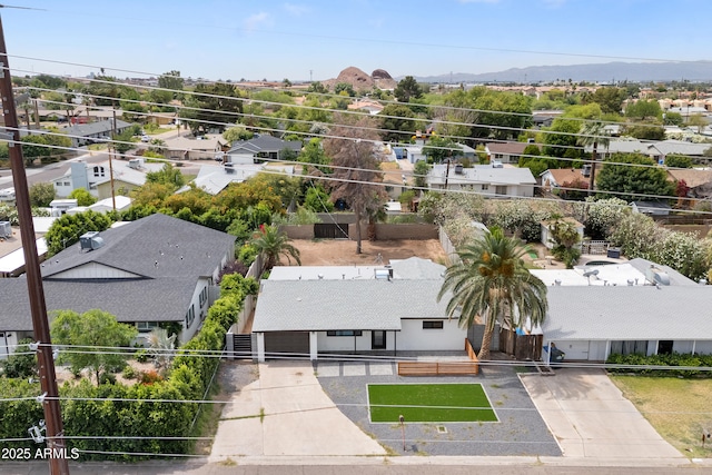 aerial view of residential area featuring property parcel outlined and mountains