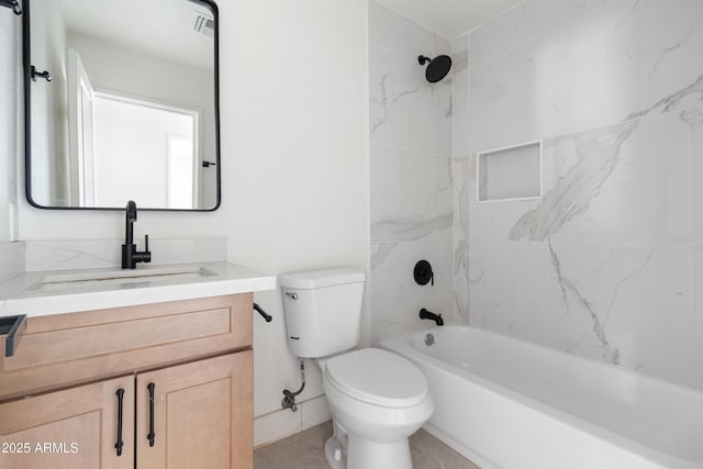 bathroom with toilet, vanity, and  shower combination