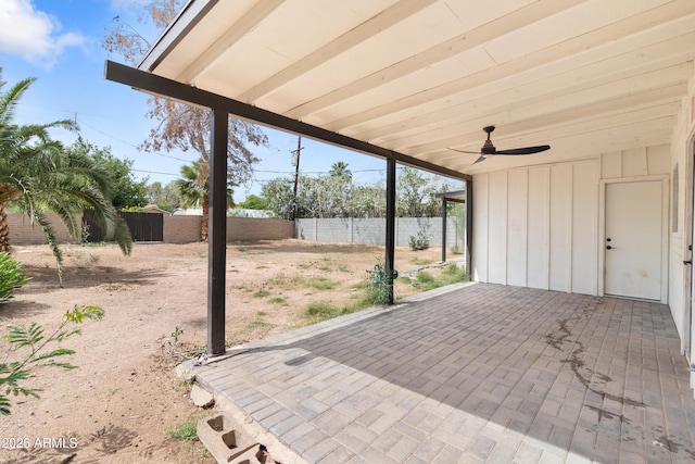 view of patio with a fenced backyard and ceiling fan