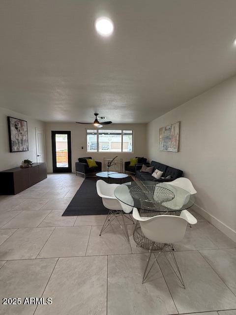 dining area featuring baseboards, recessed lighting, and light tile patterned flooring