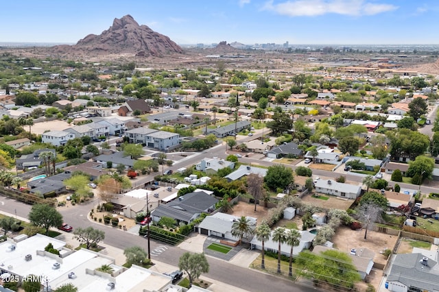 aerial perspective of suburban area with a mountainous background