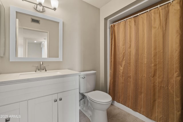 full bathroom with toilet, vanity, visible vents, and tile patterned floors