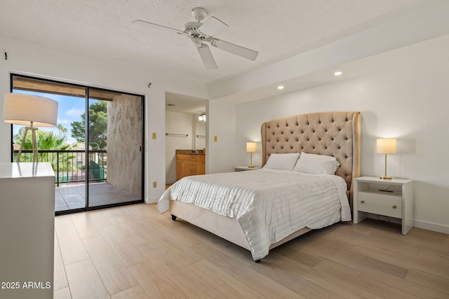 bedroom with a textured ceiling, connected bathroom, baseboards, access to outside, and light wood finished floors