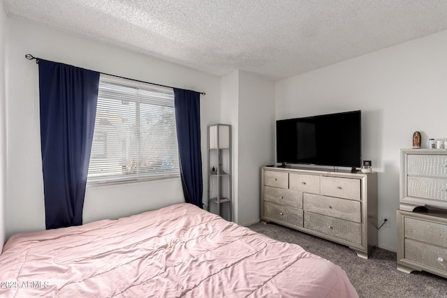 carpeted bedroom featuring a textured ceiling