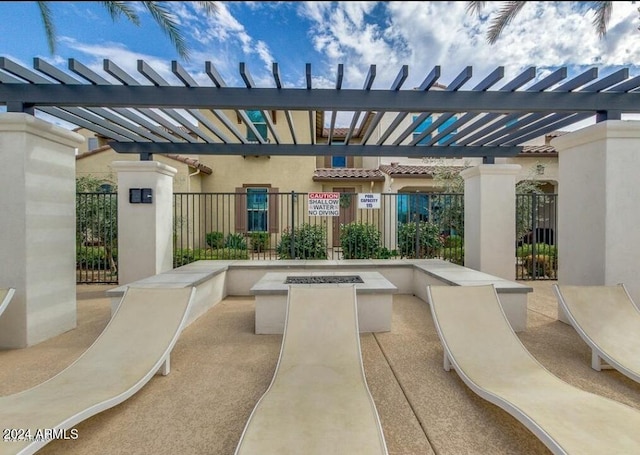 view of patio / terrace featuring a fire pit and a pergola