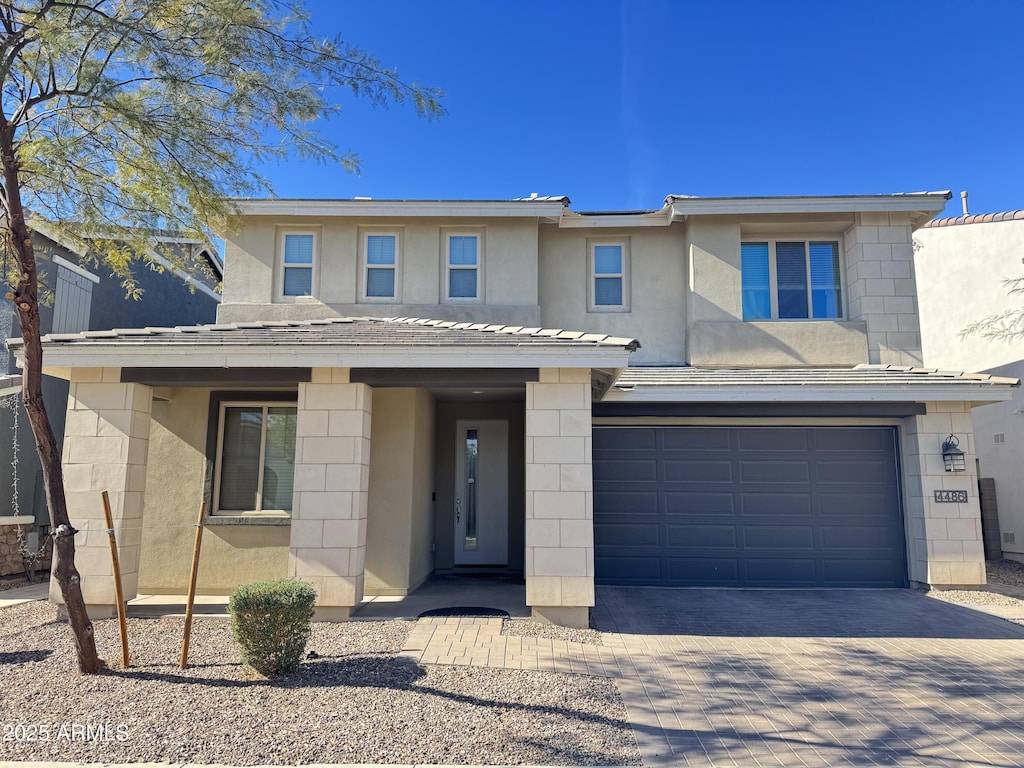 view of front of property with a garage