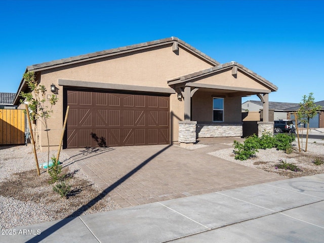 ranch-style home featuring a garage