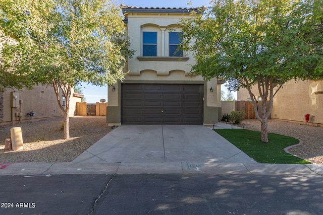 view of front of property with a garage