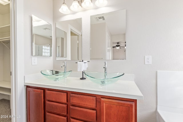 bathroom featuring vanity and ceiling fan