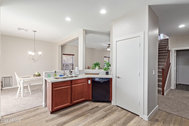 kitchen featuring light hardwood / wood-style floors, black dishwasher, sink, and pendant lighting