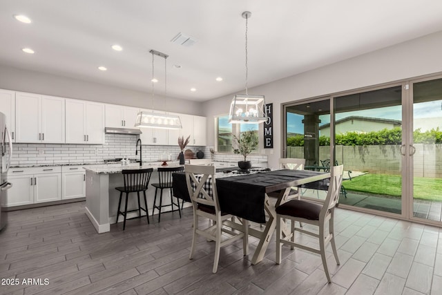 3938 E Appaloosa Rd, Gilbert, AZ 85296 - dining area featuring wood finished floors and recessed lighting