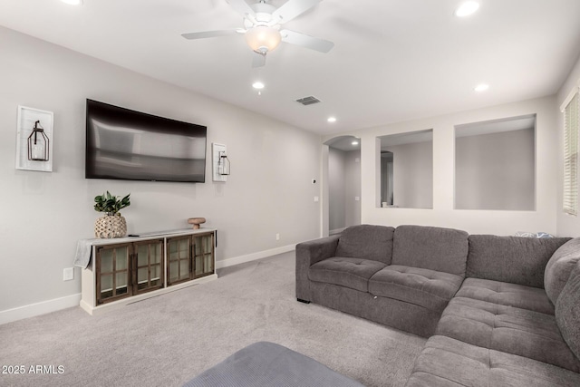 3938 E Appaloosa Rd, Gilbert, AZ 85296 - carpeted living area featuring arched walkways, baseboards, recessed lighting, and a ceiling fan