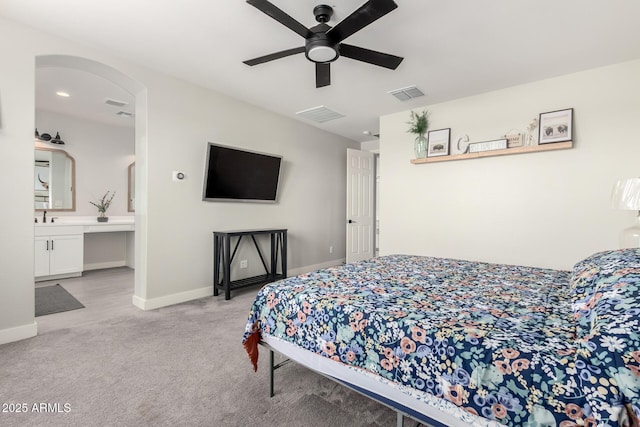 3938 E Appaloosa Rd, Gilbert, AZ 85296 - bedroom with light carpet, baseboards, arched walkways, ensuite bathroom, and ceiling fan