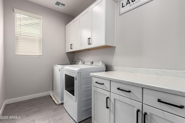 3938 E Appaloosa Rd, Gilbert, AZ 85296 - laundry room featuring cabinet space, washing machine and dryer, light wood-type flooring, and baseboards