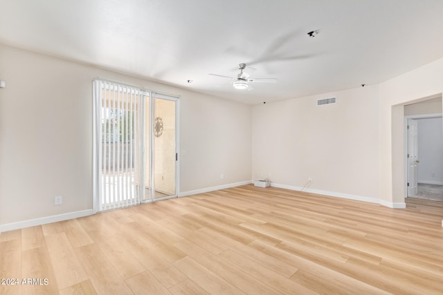 empty room featuring light wood-type flooring and ceiling fan