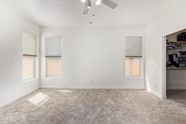 unfurnished room featuring carpet floors and ceiling fan