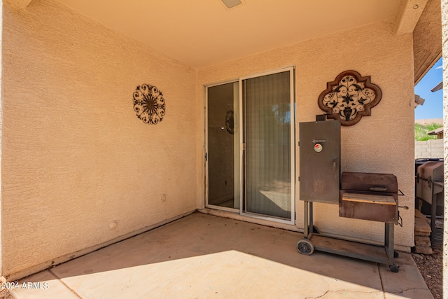 property entrance with a patio