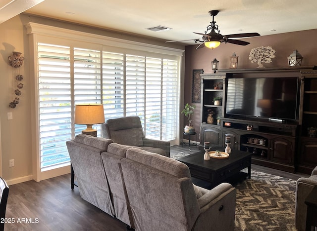 living room with dark hardwood / wood-style floors and ceiling fan