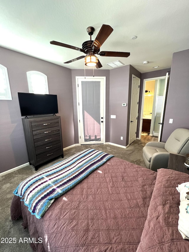 bedroom with ceiling fan, ensuite bathroom, carpet floors, visible vents, and baseboards