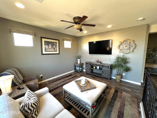 living area with a ceiling fan, recessed lighting, baseboards, and wood finished floors