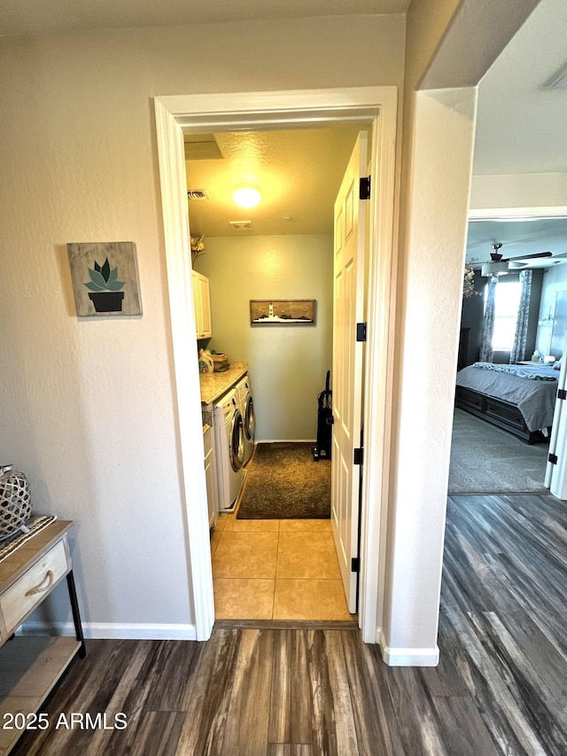 corridor featuring washing machine and clothes dryer and dark hardwood / wood-style floors