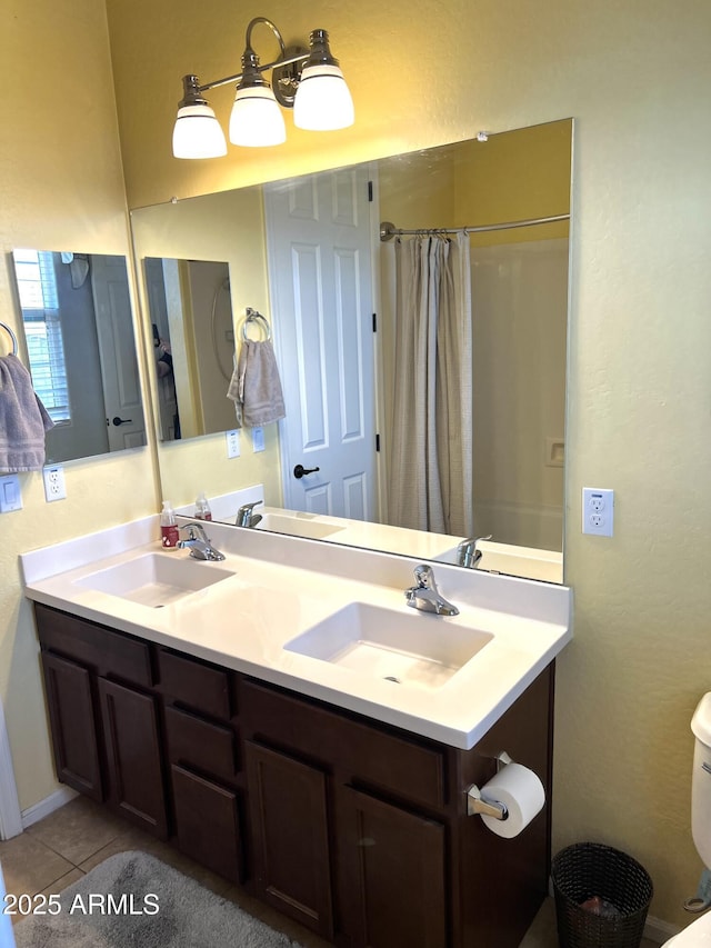 full bathroom with tile patterned flooring, a sink, and a shower with shower curtain