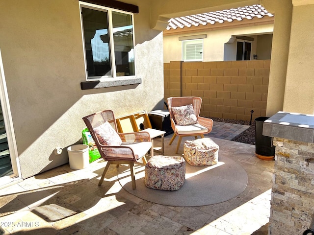 view of patio with fence and an outdoor hangout area