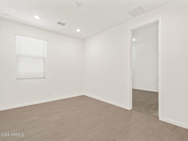 unfurnished room featuring light hardwood / wood-style floors