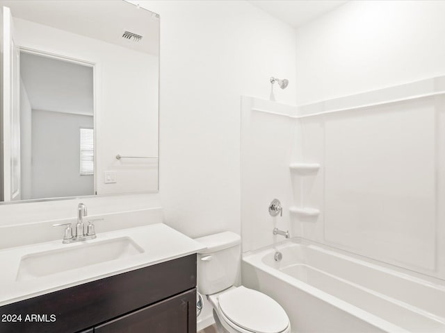 full bathroom featuring bathtub / shower combination, vanity, and toilet