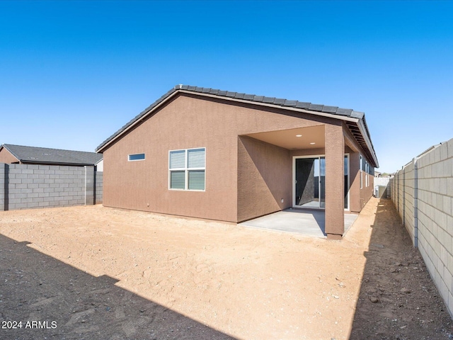 back of house with a patio area