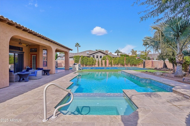 view of pool featuring a patio and ceiling fan