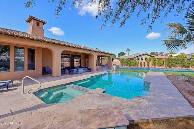 view of pool featuring an in ground hot tub and a patio area