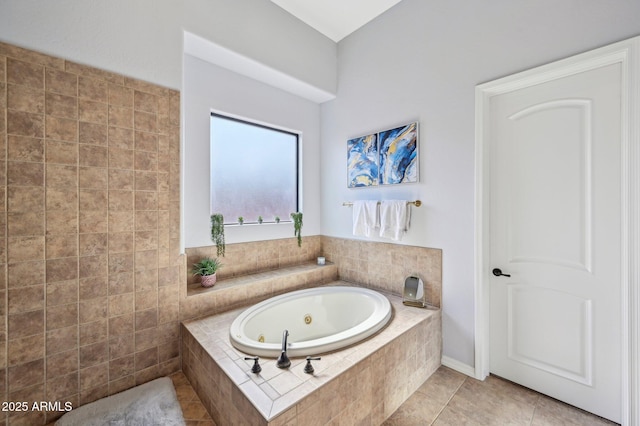 bathroom with tiled bath and tile patterned flooring