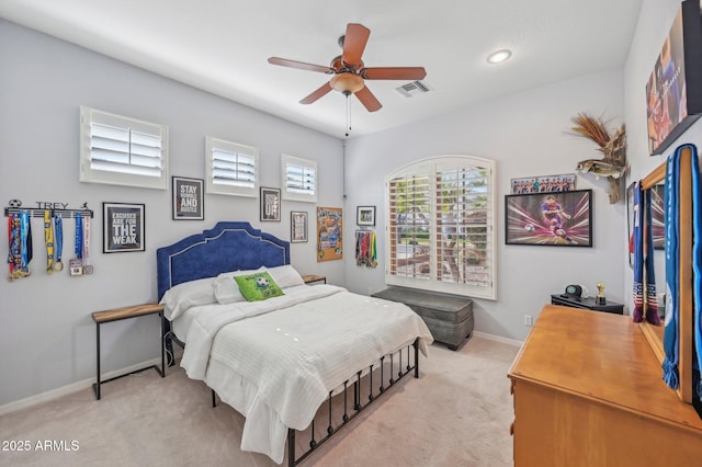 bedroom featuring light carpet and ceiling fan