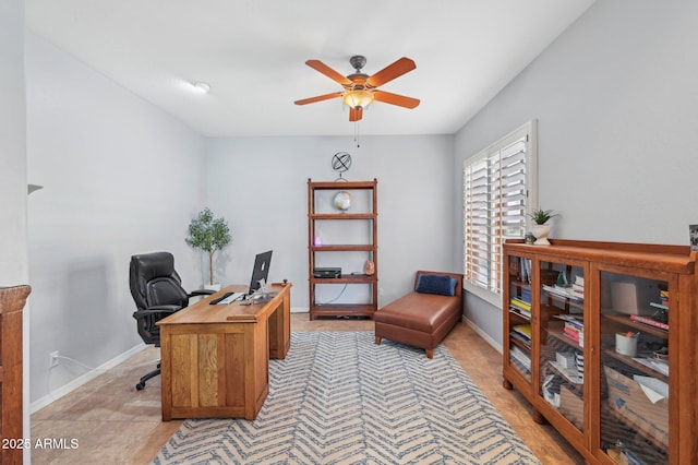 office space featuring light tile patterned floors and ceiling fan