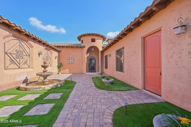 doorway to property featuring a patio area