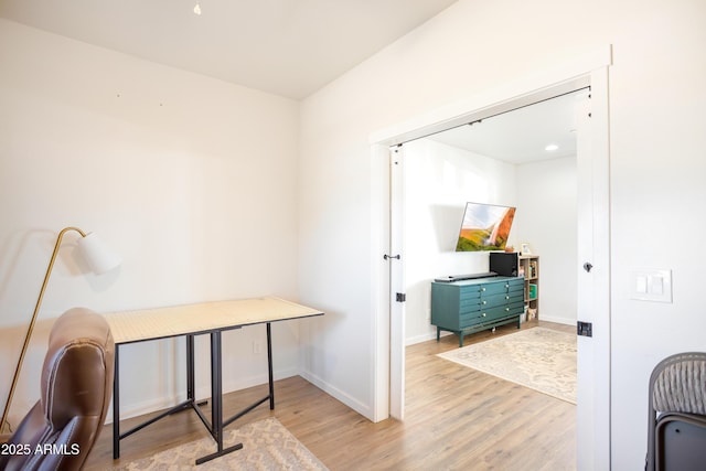 office area with wood finished floors and baseboards