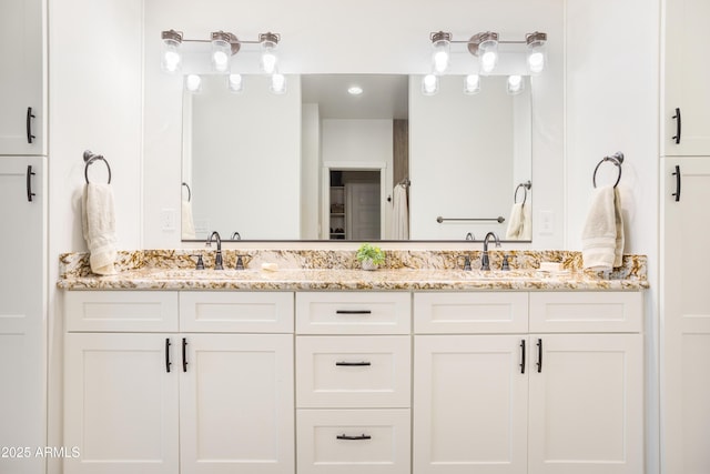 bathroom with double vanity and a sink