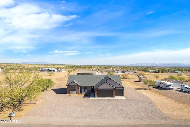 birds eye view of property with a mountain view