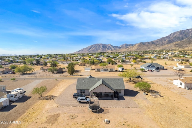 drone / aerial view featuring a mountain view and a residential view