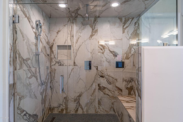 full bath featuring a marble finish shower and recessed lighting