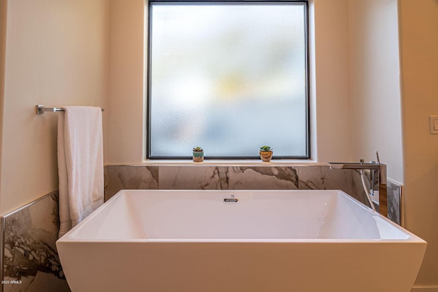 full bathroom with a freestanding tub