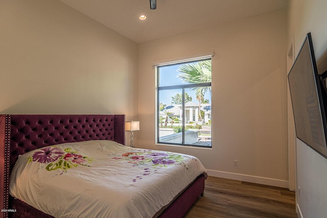 bedroom featuring recessed lighting, wood finished floors, and baseboards