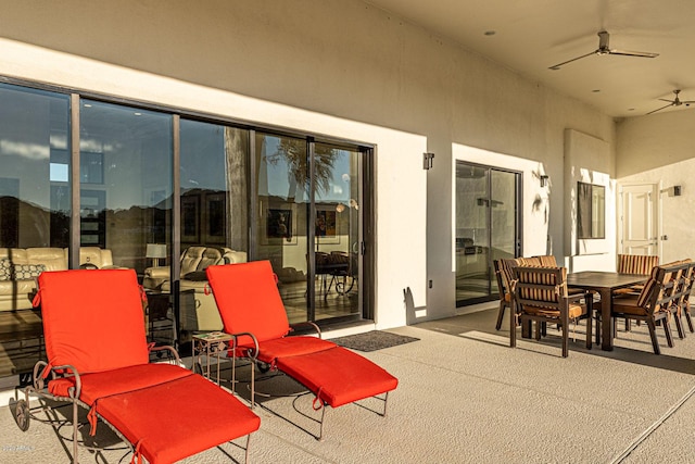 view of patio featuring a ceiling fan and outdoor dining space