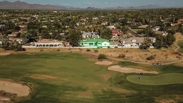 birds eye view of property featuring view of golf course and a mountain view