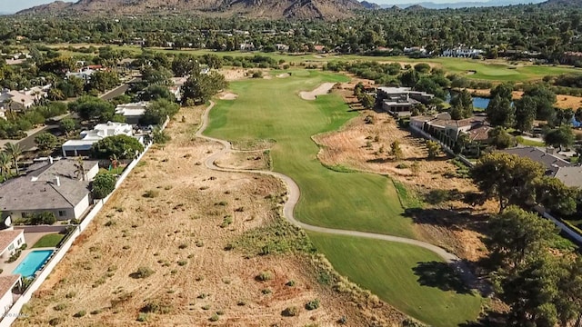 bird's eye view featuring golf course view and a mountain view