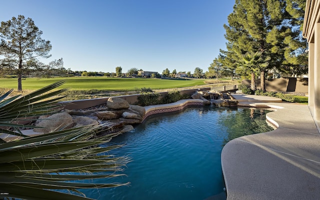 view of pool featuring a patio and a lawn