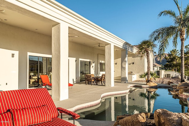 outdoor pool featuring a patio and ceiling fan