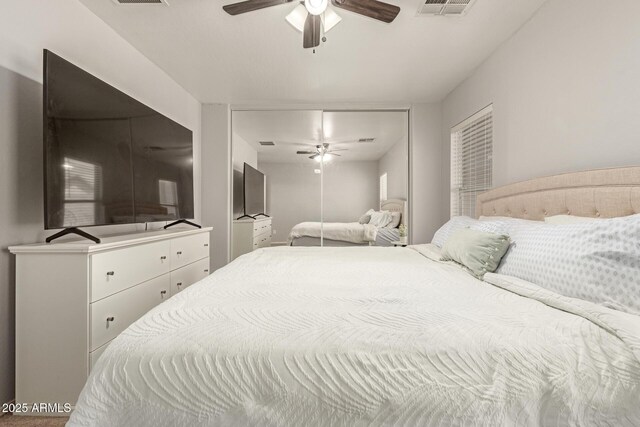bedroom featuring a ceiling fan and visible vents