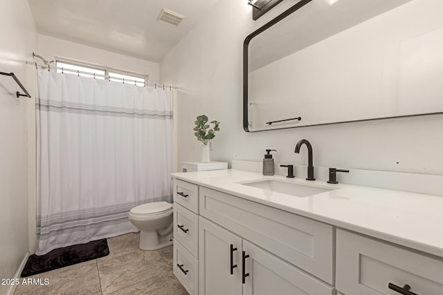 bathroom with visible vents, toilet, and vanity